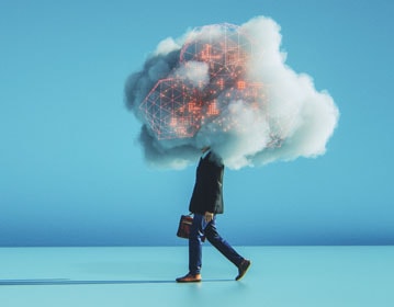 Business man walking with his head in a digital cloud