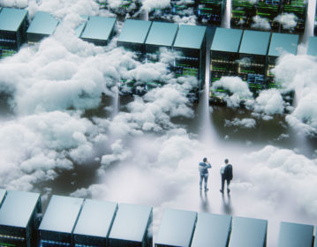Business people standing among clouds
